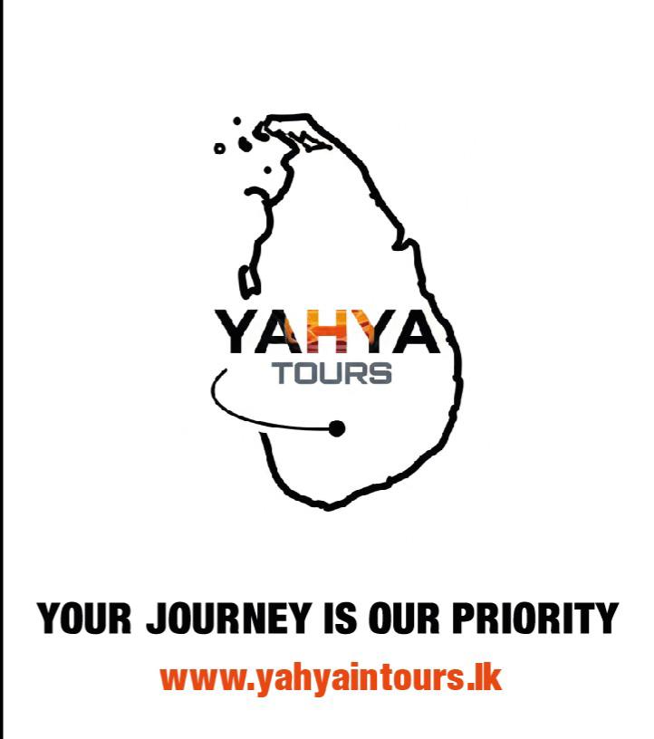 A man standing in front of a waterfall in Sri Lanka